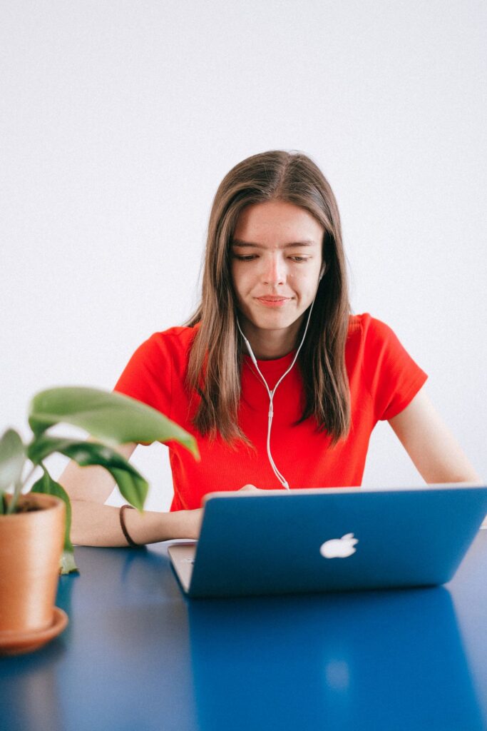 Professional woman using business email on a Mac computer